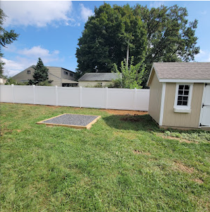 a neat house and fence landscaping