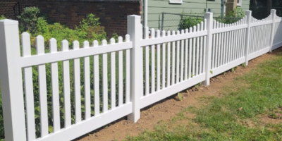 white vinyl picket fence in back yard