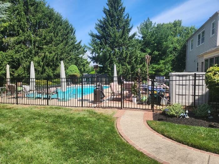 a black pool code aluminum fence installed in bucks county pennsylvania